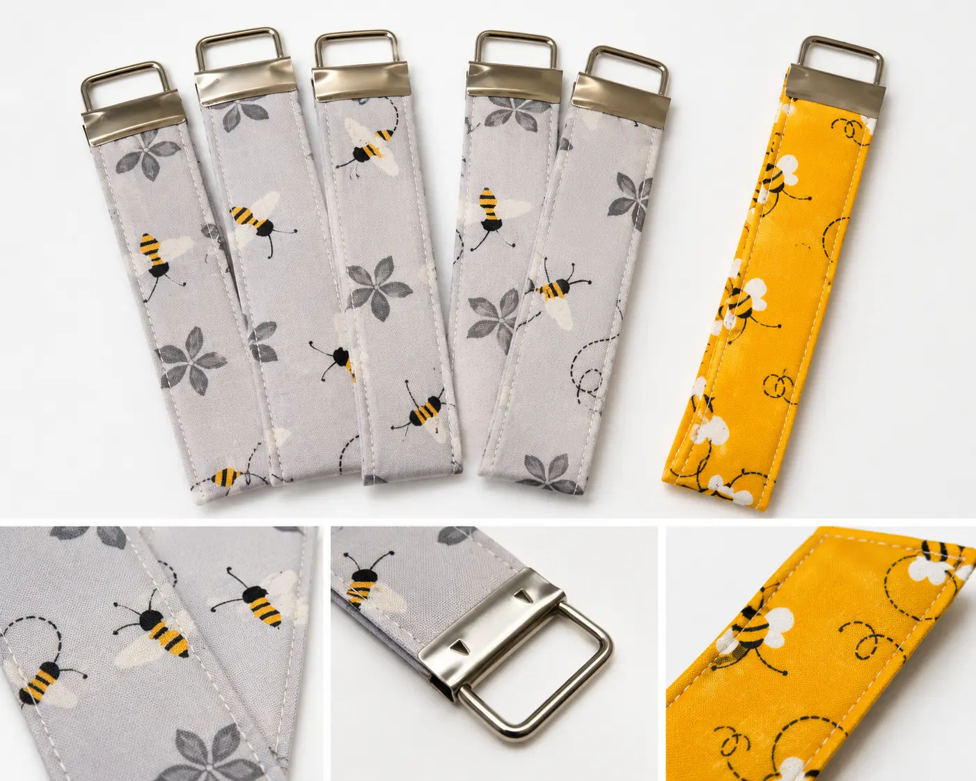 Fabric key fobs and wristlet accessories in bee-themed and floral prints with metal keychain hardware