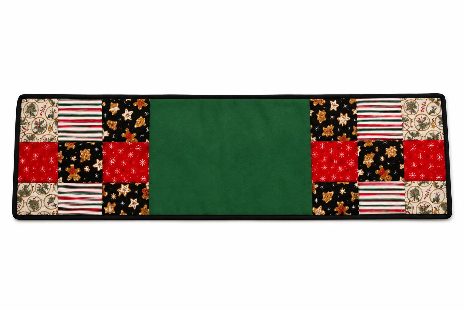 Handmade Christmas patchwork table runner with a green center section and contrasting dark binding