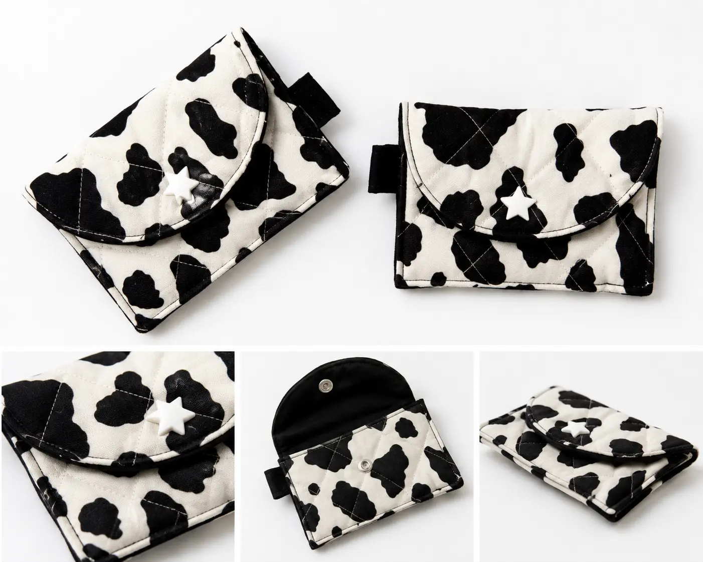 Black-and-white cow print quilted pouches with contrasting dark trim and decorative star-style snap closures