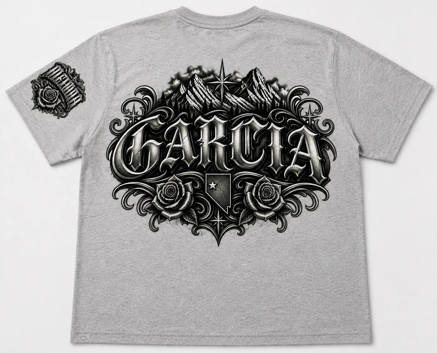 Gray custom T-shirt featuring a large black and gray Garcia back graphic with mountains, roses, ornamental scrollwork, and coordinating sleeve artwork