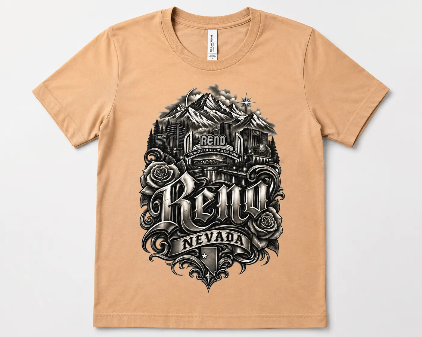 Tan custom T-shirt featuring a detailed black and gray Reno Nevada graphic with mountains, city landmarks, roses, and gothic lettering
